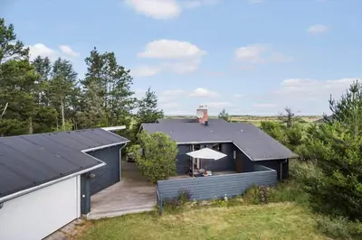 a house with a deck and a roof at JB363-Fjerritslev-Tolderstien-8 in Fjerritslev