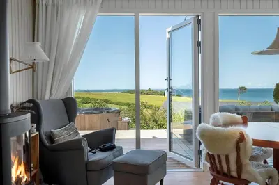 a living room with a view of the ocean at G322-Lemvig-Gyvelvej-22 in Lemvig