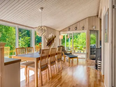 a dining room with a table and chairs at Holiday Home Elizabeth - 150m to the fjord by Interhome in Fur