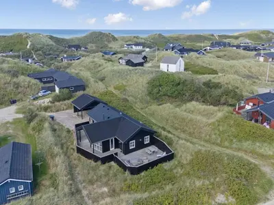 an aerial view of a house on the beach at Holiday Home Alde - 150m from the sea by Interhome in Blokhus