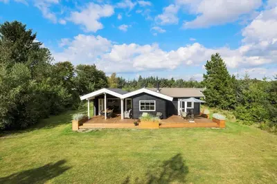 a house with a large deck in a yard at BL1123-Saltum-Jydske-Rev-5 in Saltum