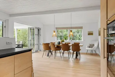 a kitchen and dining room with a table and chairs at BL1123-Saltum-Jydske-Rev-5 in Saltum