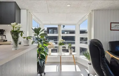 a kitchen with a table with plants and a window at Gorgeous Home In Thisted With House A Panoramic View in Thisted