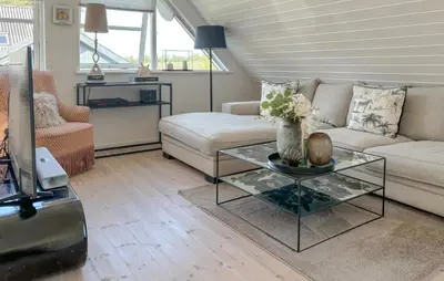 a living room with a couch and a glass table at Gorgeous Home In Farsø With Wifi in Farsø