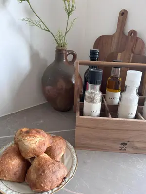 a plate of bread on a table next to a wooden box at Udsigtsvilla Tambohus in Thyholm