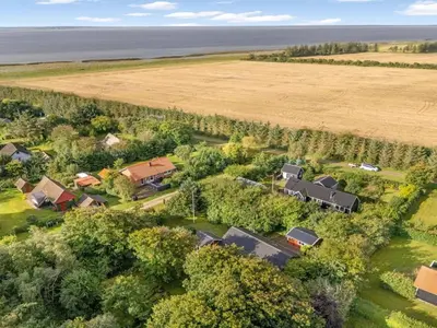 an aerial view of a farm with a field at Holiday Home Elea - 450m to the fjord by Interhome in Vemb