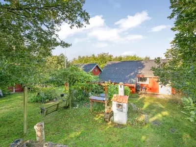 a yard with a house in the background at Holiday Home Elea - 450m to the fjord by Interhome in Vemb