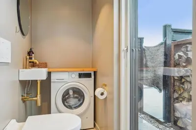 a bathroom with a washing machine and a window at BL1126-Saltum-Porsevej-14 in Saltum