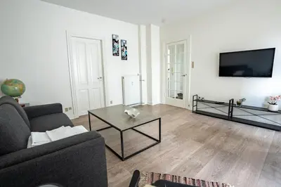 a living room with a couch and a coffee table at Holstebro Apartments in Holstebro