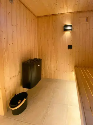 a room with a black trash can in a room at Holiday Home With Pool And Fjord Views On Lundø in Højslev