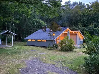 a small cabin in the middle of a yard at Holiday Home Between Beach And Forest On Mors in Øster Assels