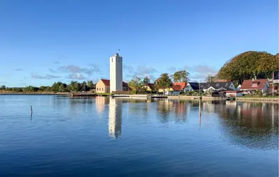 a large body of water with a building in the background at 3 Bedroom Gorgeous Home In Hurup Thy in Doverodde