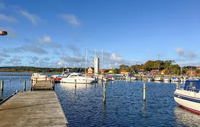 a group of boats docked at a dock in the water at 3 Bedroom Gorgeous Home In Hurup Thy in Doverodde