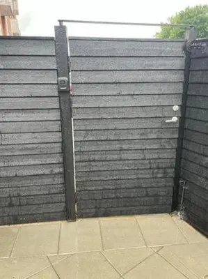 a large privacy fence with a black wall at Østerbrogade 49 in Holstebro