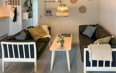 a living room with a couch and a table at Pet Friendly Home In Vestervig With Sauna in Vestervig