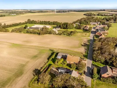 an aerial view of a house in a field at Holiday Home Missa - 2km to the fjord by Interhome in Ejerslev