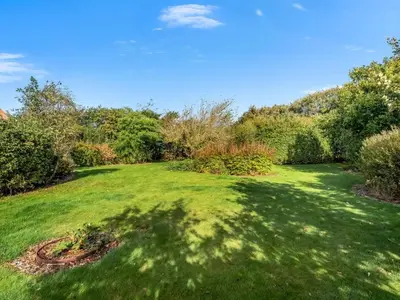 a large yard with green grass and trees at Holiday Home Nette - 2km to the fjord by Interhome in Thyholm