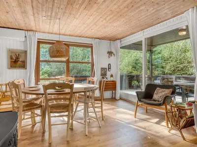 a dining room with a table and chairs at Holiday Home Ingamaj - 4km from the sea by Interhome in Brovst