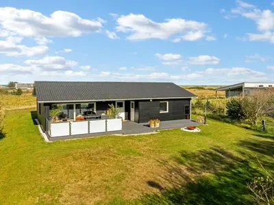 a small house with a large yard at Holiday Home Sarika - 500m from the sea by Interhome in Fjerritslev