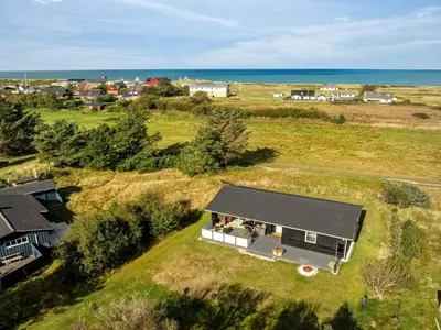 an overhead view of a house in a field at Holiday Home Sarika - 500m from the sea by Interhome in Fjerritslev