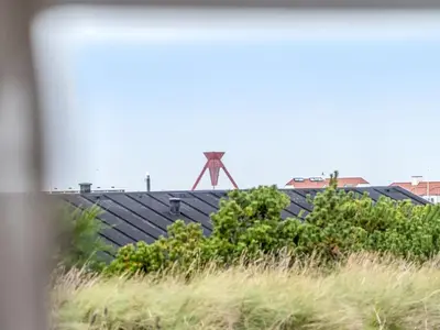 a windmill on the roof of a house at Holiday Home Adelbrand - 1km from the sea by Interhome in Blokhus