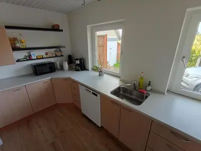 a kitchen with a sink and a counter top at Apartment with water views in Fjerritslev