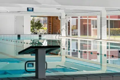 a swimming pool with a table in the middle of it at G346-Lemvig-Vinkelhagevej-46 in Lemvig