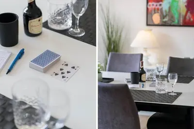 a table with wine glasses and a bottle of wine at 719-Thyboron-Fanovej-3 in Thyborøn