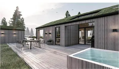 a wooden deck with a table and a swimming pool at BL1127-Saltum-Bondagervej-23 in Saltum