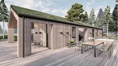 a building with a table and chairs on a deck at BL1127-Saltum-Bondagervej-23 in Saltum