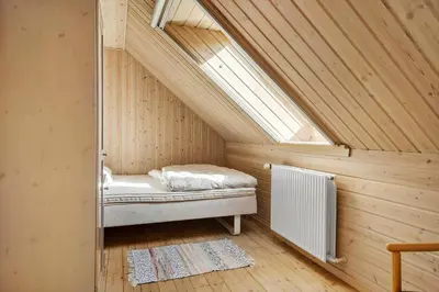 a small attic room with a bed and a skylight at 852-Bedsted-Thy-Istrupvej-35 in Bedsted Thy