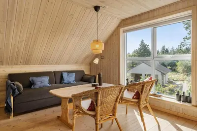 a living room with a couch and a table at 852-Bedsted-Thy-Istrupvej-35 in Bedsted Thy