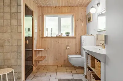 a bathroom with a white toilet and a sink at 852-Bedsted-Thy-Istrupvej-35 in Bedsted Thy