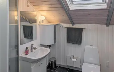 a bathroom with a sink and a toilet at Amazing Home In Spøttrup With House A Panoramic View in Spottrup