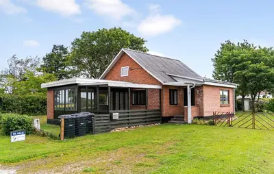 a small brick house with a large yard at 1 Bedroom Nice Home In Hurup Thy in Ullerup