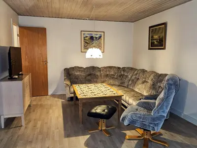 a living room with a couch and a table at 6 person holiday home in Lemvig in Lemvig