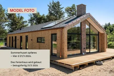 a tiny house with a roof on a deck at 821-Harboore-Vejlby-Klit-6-b in Harboør