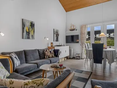 a living room with a couch and a table at Apartment Benthe - 100m to the fjord by Interhome in Vestervig
