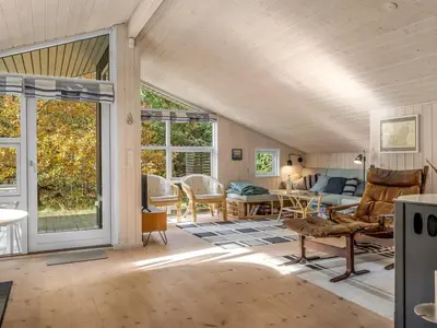 a living room with a couch and a table at Holiday Home Peder - 4km from the sea by Interhome in Fjerritslev