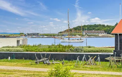 a sail boat is docked in a harbor at Awesome Home In Thisted With House Sea View in Thisted