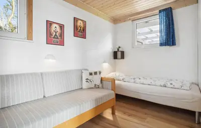 a small room with a couch and a window at Amazing Home In Snedsted With Wifi in Snedsted