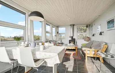 a living room with white furniture and large windows at Amazing Home In Snedsted With Wifi in Snedsted