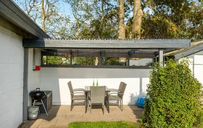 a patio with a table and chairs under a pergola at Amazing Home In Snedsted With Wifi in Snedsted