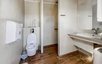 a bathroom with a toilet and a sink at 2 Bedroom Beautiful Home In Hanstholm in Hanstholm