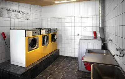 a laundry room with two washers and a sink at Gorgeous Home In Hanstholm With Outdoor Swimming Pool in Hanstholm