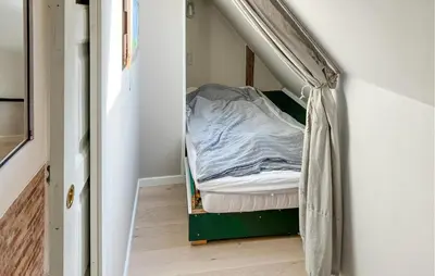 a small room with a bed in the corner at 2 Bedroom Stunning Home In Lemvig in Lemvig