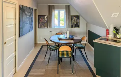 a small dining room with a table and chairs at 2 Bedroom Stunning Home In Lemvig in Lemvig