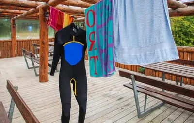 a person in a wetsuit standing on a deck at Beautiful Home In Hanstholm With Swimming Pool in Hanstholm