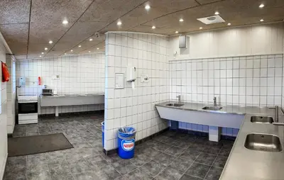 a public bathroom with two sinks and a tub at 2 Bedroom Stunning Home In Hanstholm in Hanstholm