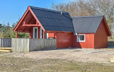a red house with a black roof at 1 Bedroom Cozy Home In Hanstholm in Hanstholm